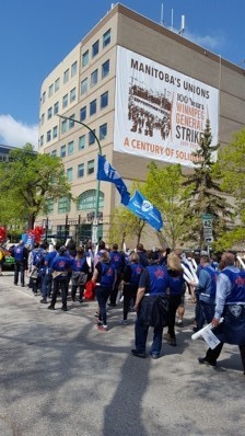 PIPSC members in front of the Manitoba Federation of Labour Union Centre building